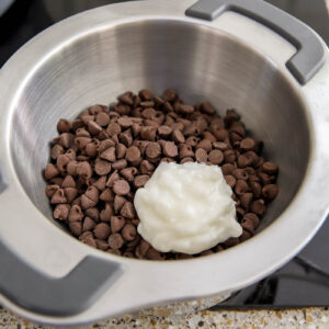 chocolate chips and coconut oil in double boiler for peanut butter balls.