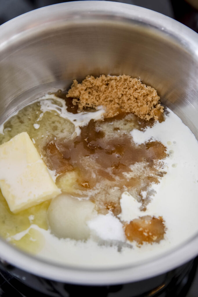 sugar, butter and cream heating on a pan for caramel glaze