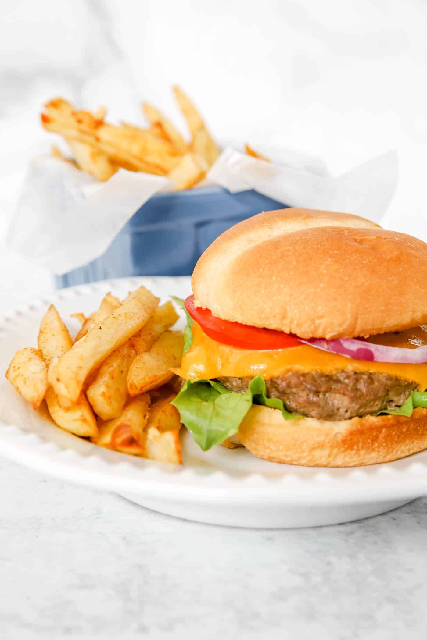 burger with fries and all the fixings.