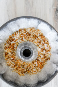 add coconut and pecans to the bottom of the bundt pan for coconut rum bundt cake.