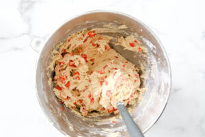 mixed strabwerries into strawberry cheesecake cookie batter.