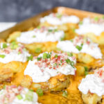 Loaded smashed potatoes side dish.