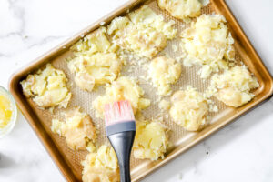 brushed smashed potatoes with butter and sprinkle with salt.