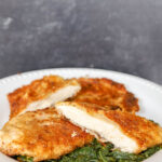 Paermesan Chicken Recipe on bed of spinach