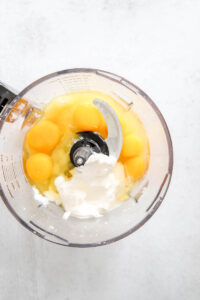 added lemon juice and eggs to lemon zest in food processor.