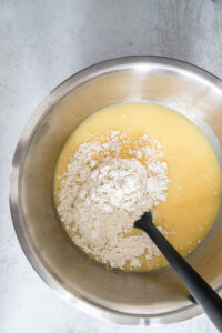 combine wet and dry ingredients for lemon Bundt cake.