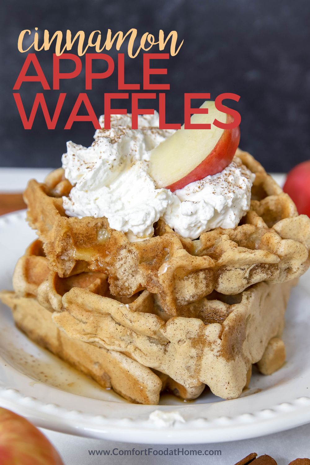 cinnamon apple waffles recipe with whipped cream and an apple slice on top.