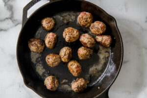 Cooking the meatballs for Swedish meatball recipe.