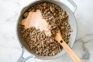 add ketchup mixture to ground beef for cheeseburger sliders