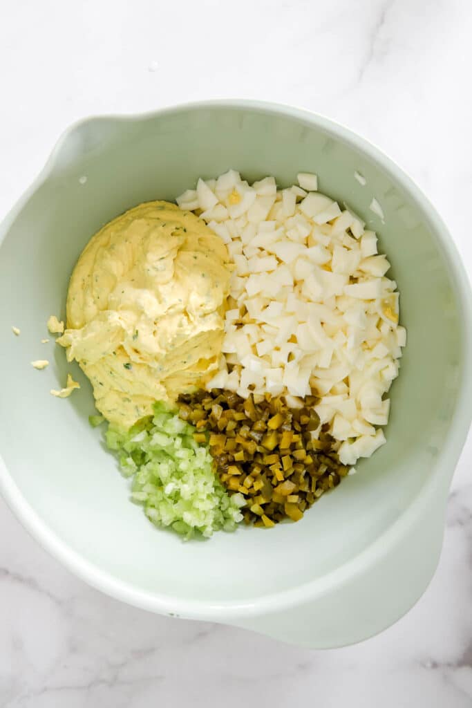 egg salad ingredients mixed together