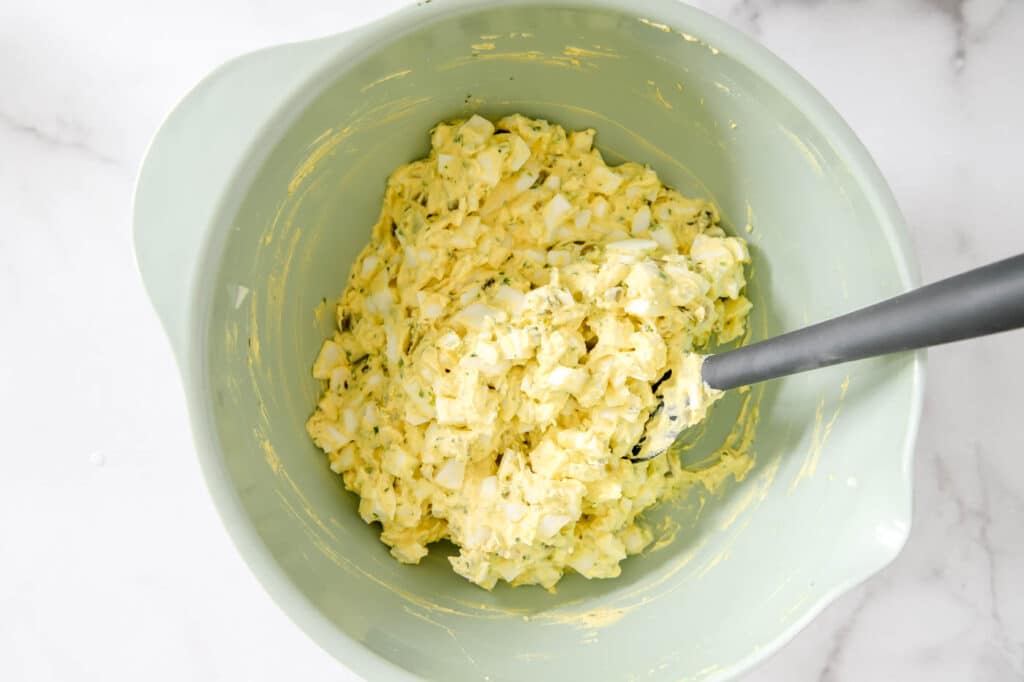 egg salad ingredients mixed together