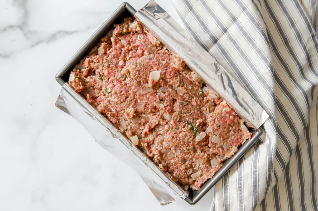 raw meatloaf meat before cooking.