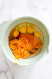 wet ingredients in a bowl for pumpkin bars