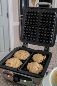 pumpkin waffles in waffle iron.