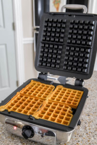 pumpkin waffles in the waffle iron.