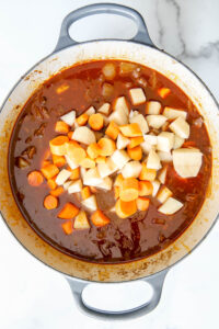 potatoes and carrots in a dutch oven for beef stew.