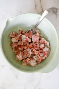 beef meat cubes in flour for beef stew.