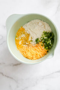 ingredients in a bowl for easy sausage muffins
