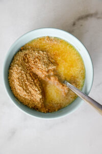 graham cracker crust ingredients in a bowl.