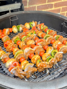 grilling beef kabobs on grill