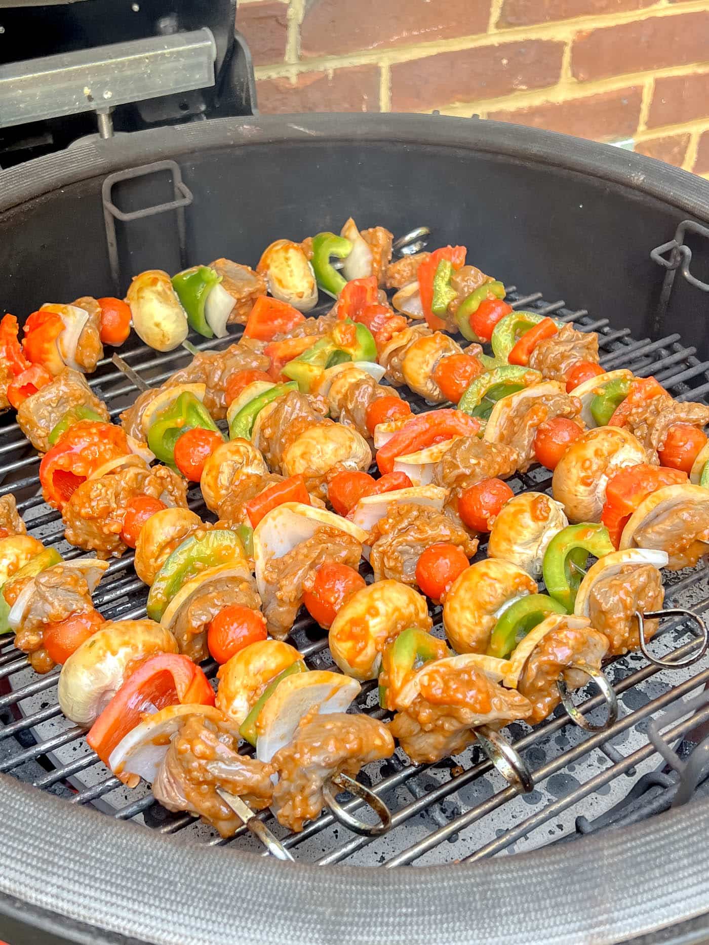 grilling beef kabobs on grill