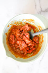 sirloin beef in bowl with marinade
