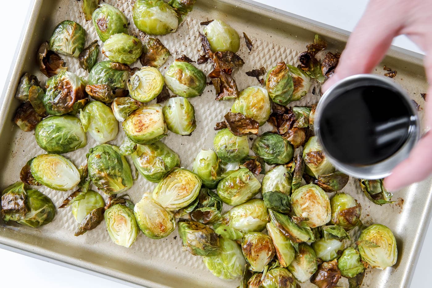 Brussels sprouts with balsamic vinegar sprinkled on top.
