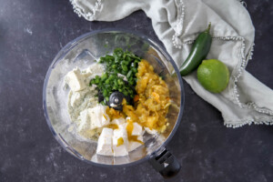 ingredients for jalapeno dip in a food processor.