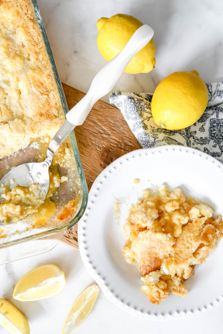 lemon dump cake scooped out on a plate.