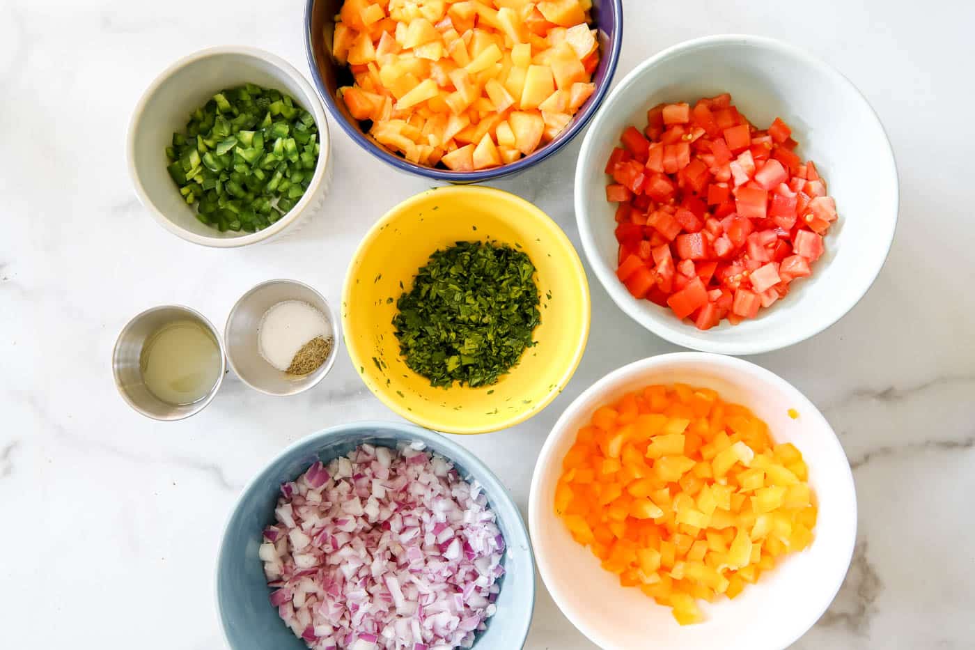 peach salsa ingredients in bowls.