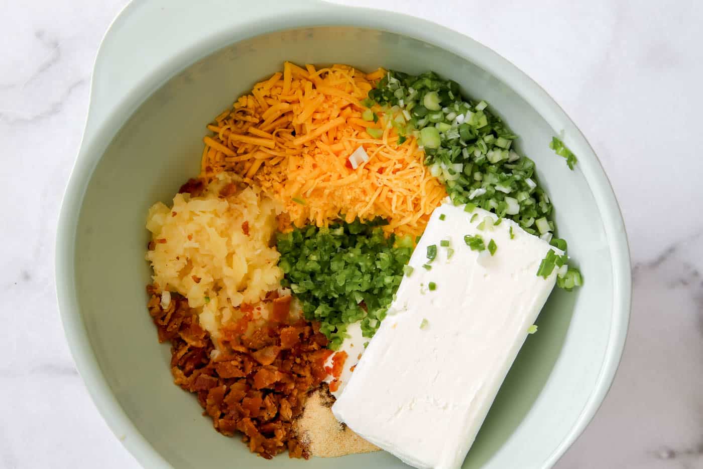 bacon and pineapple cheese ball ingredients in a bowl.