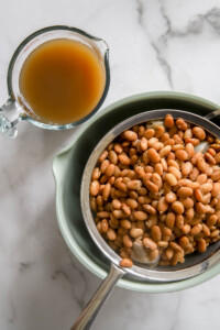 strained beans and reserved liquid for refried beans.