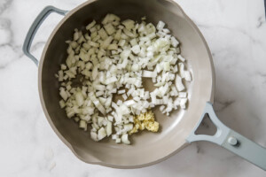 onions and garlic in a pan for refried beans.
