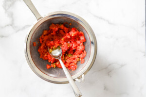 strain tomatoes and green chilies for Sausage and Cream Cheese Pinwheels recipe