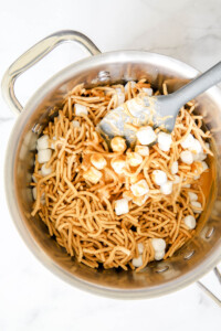 chow mein noodles with butterscotch and marshmallows in a saucepan