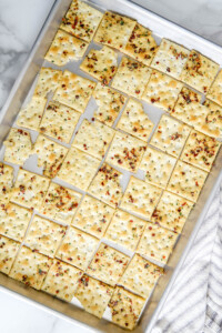 fire ranch crackers on a baking sheet.