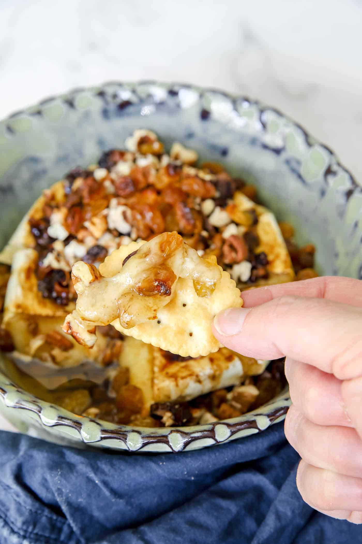 baked brie with apples, pecans and raisins