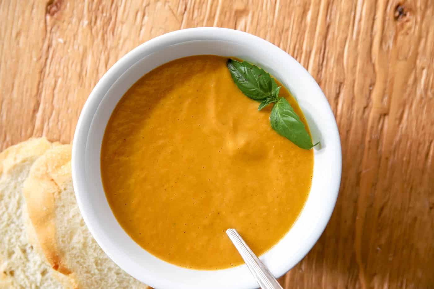 tomato basil soup in a white bowl.
